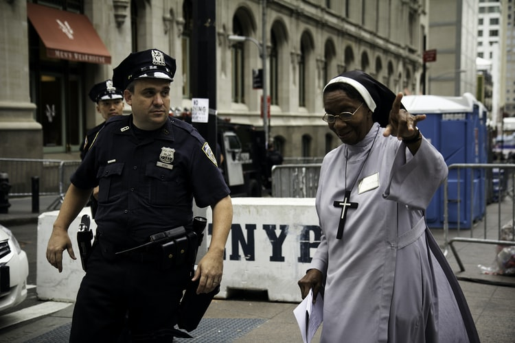 policeman speaking to a nun