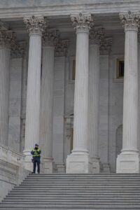 a court officer standing outside the court