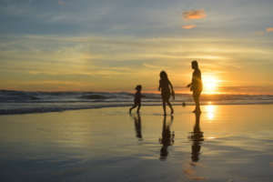 Family enjoying the beach in vacation