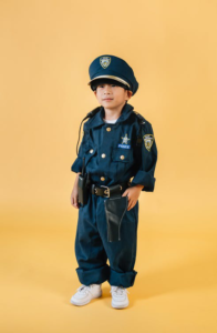 A child wearing a police uniform children’s costume