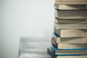 A pile of books on a desk