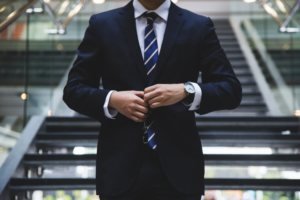 A person walking down the stairs in executive suit